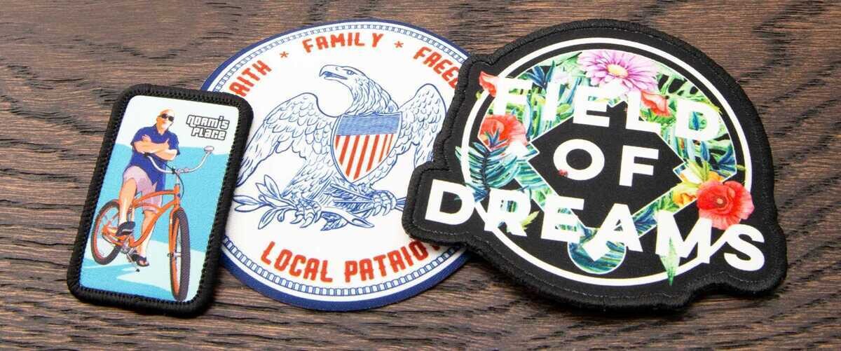 Collection of printed patches including cyclist, patriotic eagle, and Field of Dreams floral design