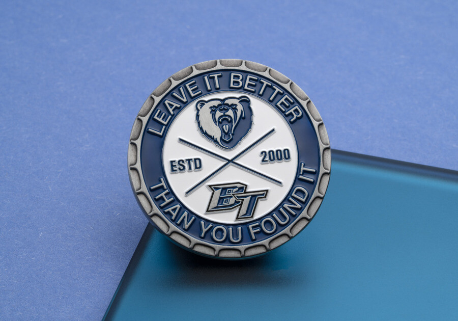 Challenge coin with a spur edge