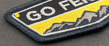 Embroidered patch with a merrowed edge